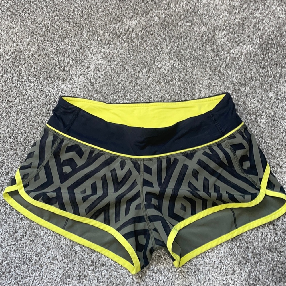 Lulu Lemon speed up 2” shorts. Lime green/yellow, black, and green/grey colored.